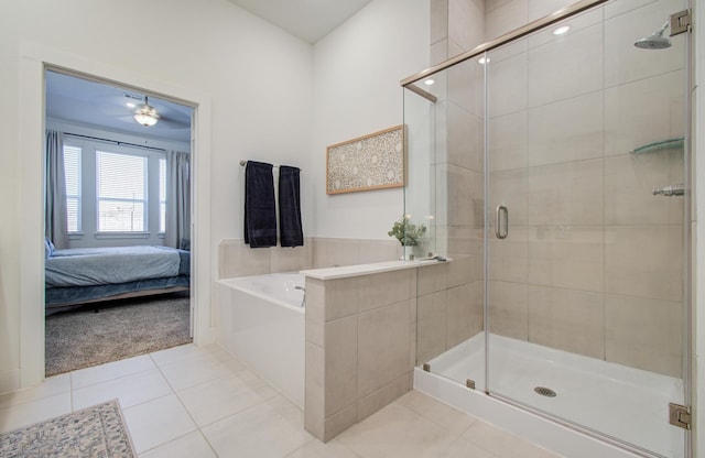 ensuite bathroom featuring a bath, a stall shower, ensuite bath, and tile patterned flooring