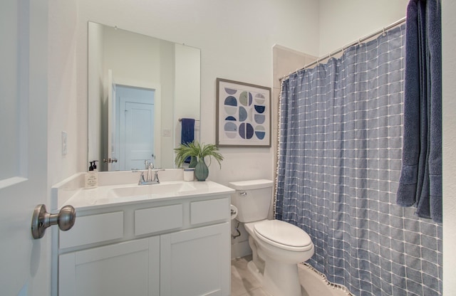 bathroom with toilet, curtained shower, and vanity