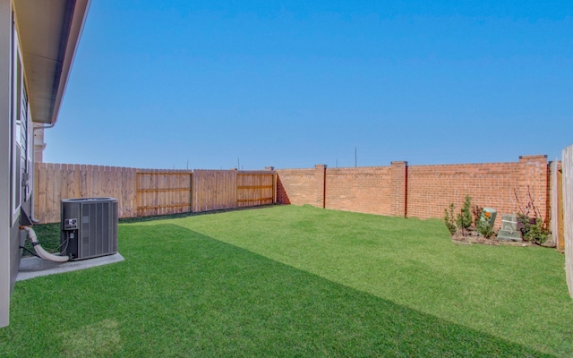 view of yard featuring a fenced backyard and cooling unit