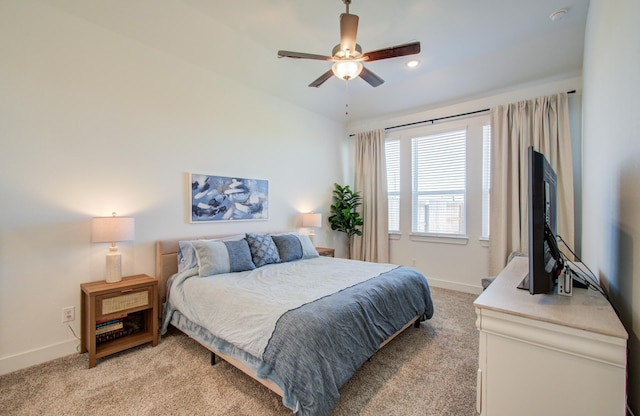 bedroom featuring a ceiling fan, recessed lighting, light carpet, and baseboards