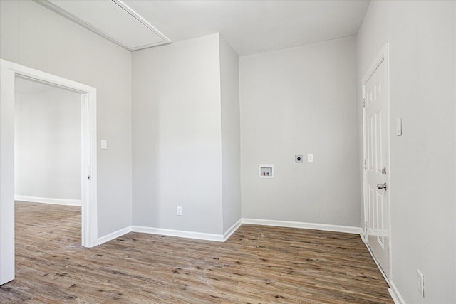 laundry area with laundry area, washer hookup, wood finished floors, and electric dryer hookup