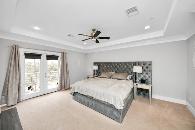 bedroom featuring light colored carpet, visible vents, access to outside, french doors, and a tray ceiling