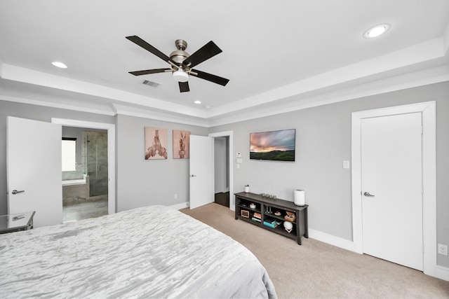 bedroom featuring light carpet, a tray ceiling, visible vents, and recessed lighting