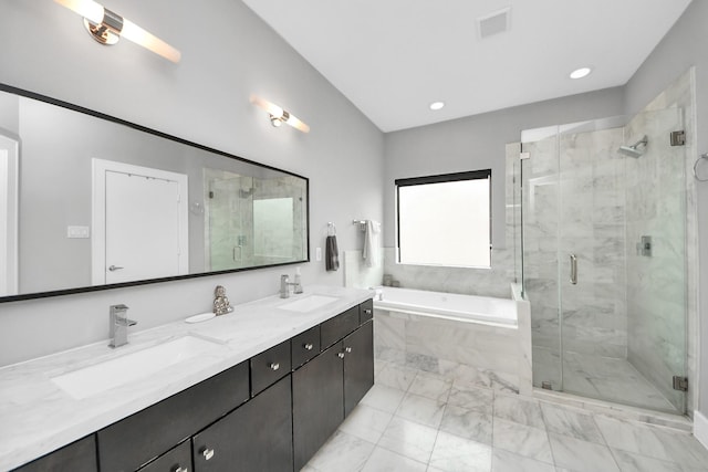 full bath featuring double vanity, a garden tub, a shower stall, and a sink