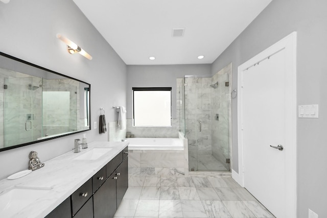 bathroom featuring double vanity, a garden tub, marble finish floor, a shower stall, and a sink