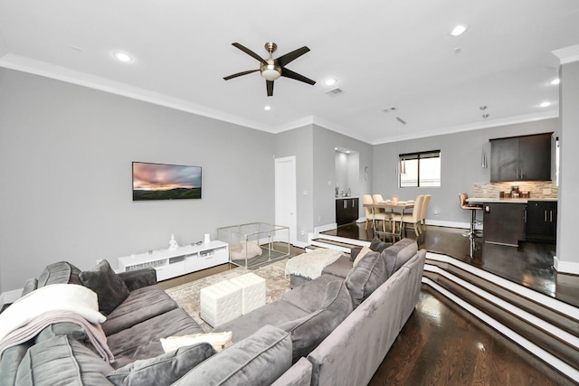 living room with dark wood-style floors, recessed lighting, baseboards, and ornamental molding