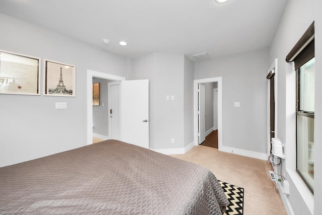 unfurnished bedroom featuring baseboards, recessed lighting, and light colored carpet