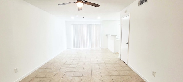 interior space with light tile patterned floors, visible vents, and baseboards