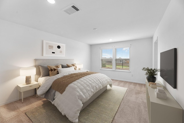 bedroom with recessed lighting, visible vents, light carpet, and baseboards