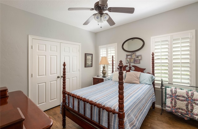 bedroom with a ceiling fan, a closet, and wood finished floors