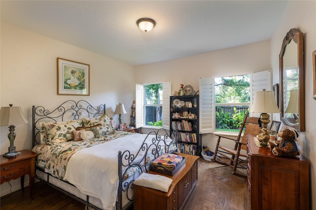 bedroom featuring wood finished floors