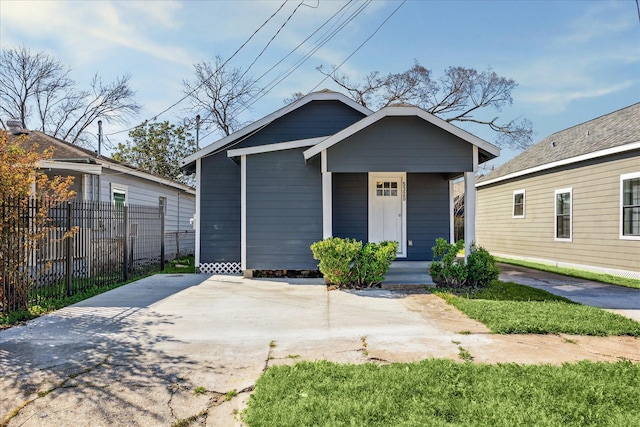 view of front of house featuring fence