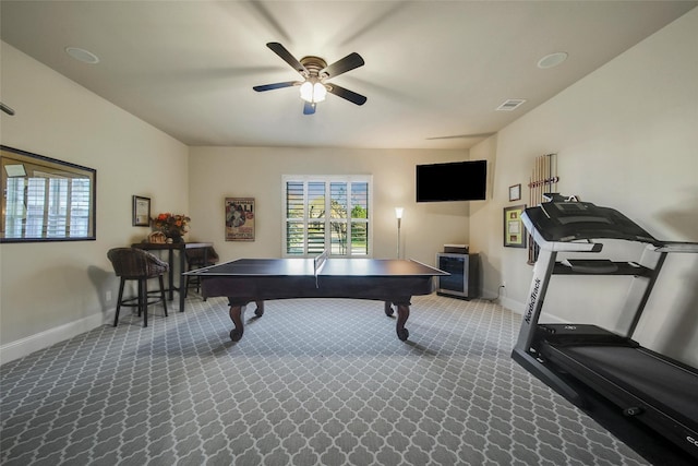 recreation room with carpet, visible vents, ceiling fan, and baseboards