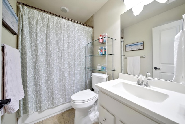 full bath featuring tile patterned flooring, shower / tub combo with curtain, vanity, and toilet