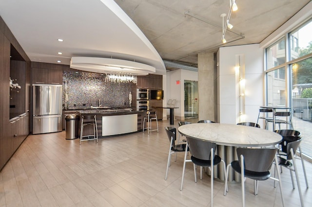 dining space featuring expansive windows and recessed lighting