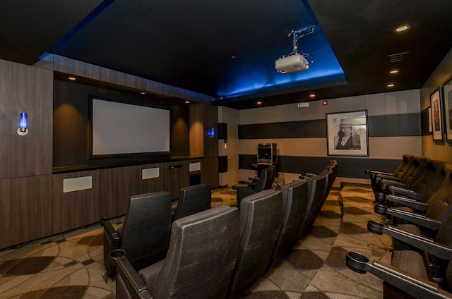 home theater featuring visible vents, a tray ceiling, and recessed lighting