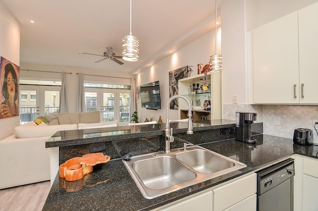 kitchen featuring black dishwasher, a sink, open floor plan, and french doors