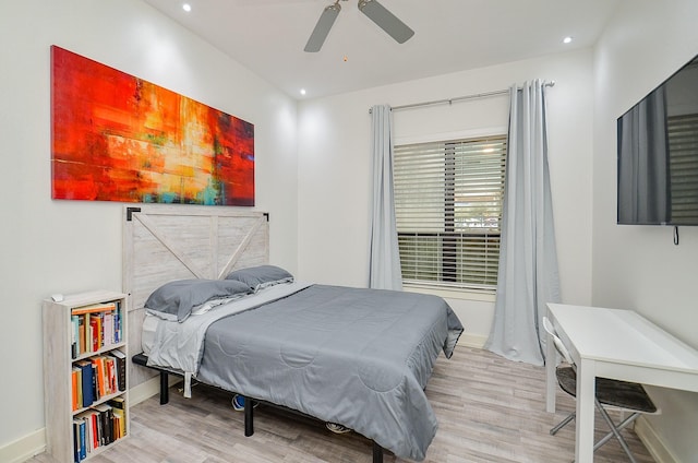 bedroom with light wood finished floors, baseboards, and recessed lighting