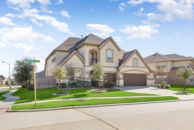 view of front of house featuring stucco siding, fence, a balcony, driveway, and a front lawn