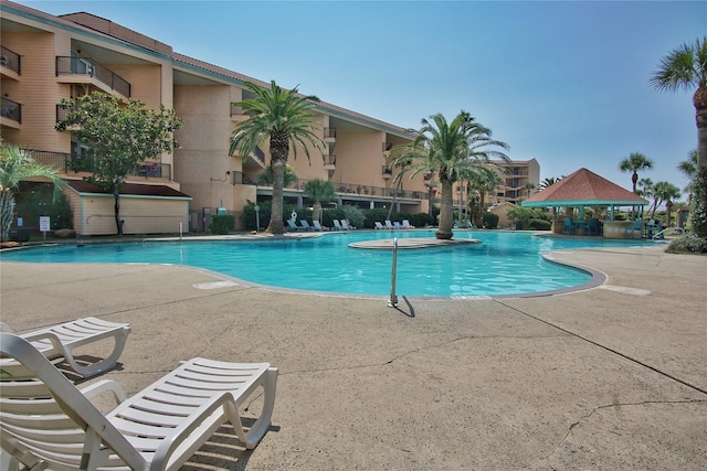 pool featuring a gazebo and a patio