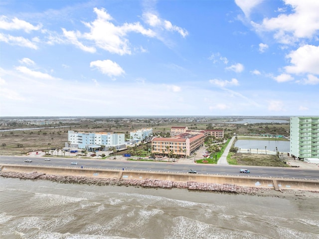 birds eye view of property featuring a water view and a view of city