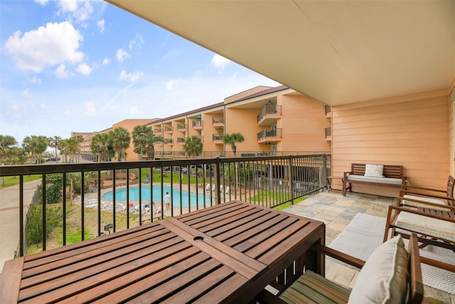 balcony with a patio area and outdoor lounge area