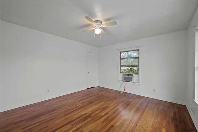 unfurnished room featuring cooling unit, dark wood finished floors, baseboards, and ceiling fan