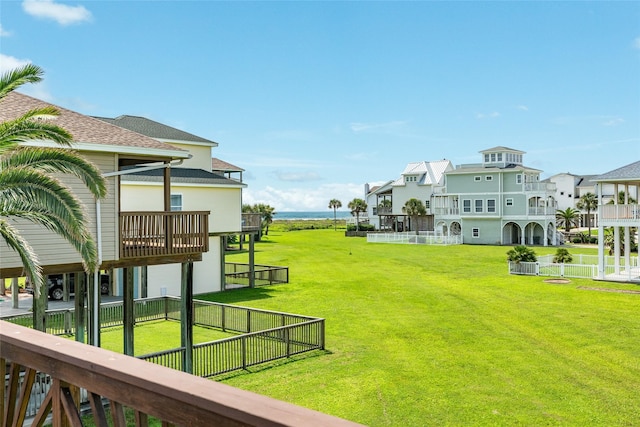 view of yard featuring fence and a residential view