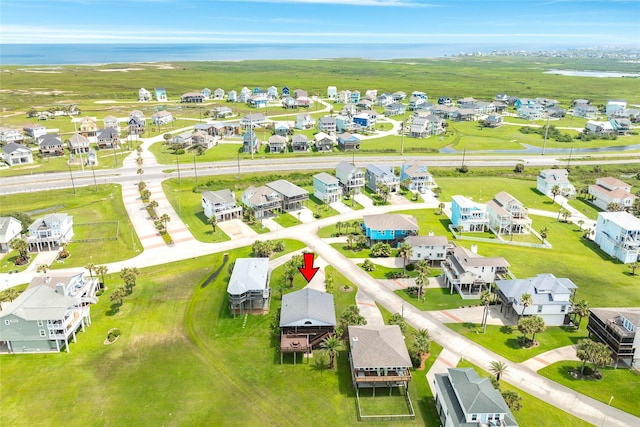 drone / aerial view with a water view and a residential view