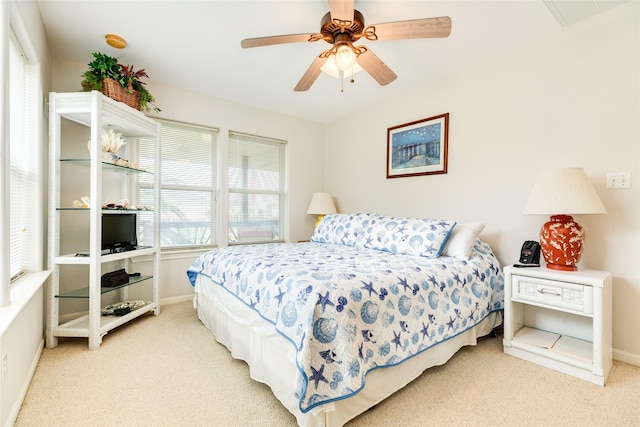 bedroom with carpet, baseboards, and a ceiling fan