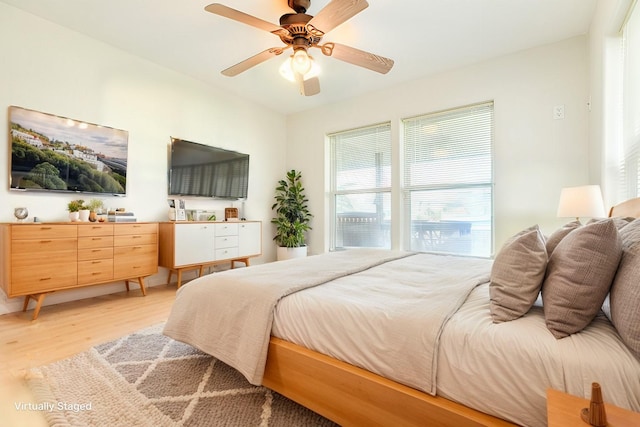 bedroom featuring ceiling fan and wood finished floors