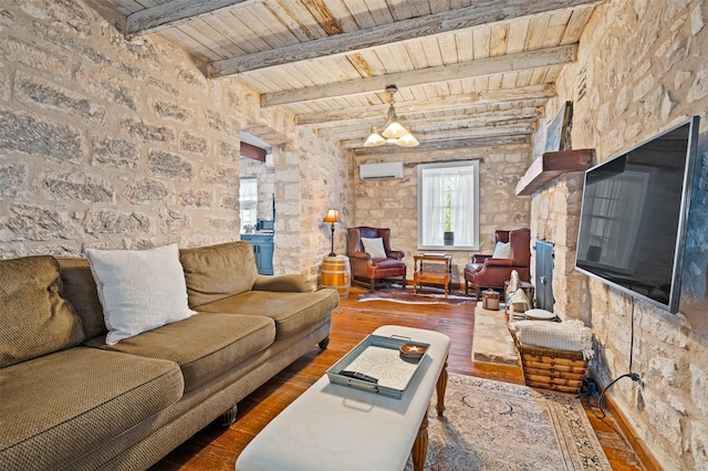 living area featuring wood ceiling, an AC wall unit, beamed ceiling, and wood finished floors