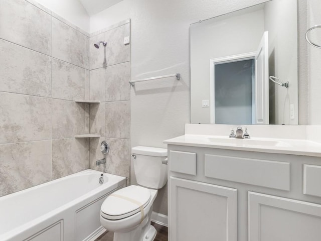 bathroom with shower / bath combination, vanity, and toilet