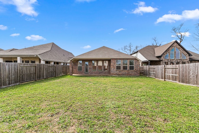 view of yard with a fenced backyard