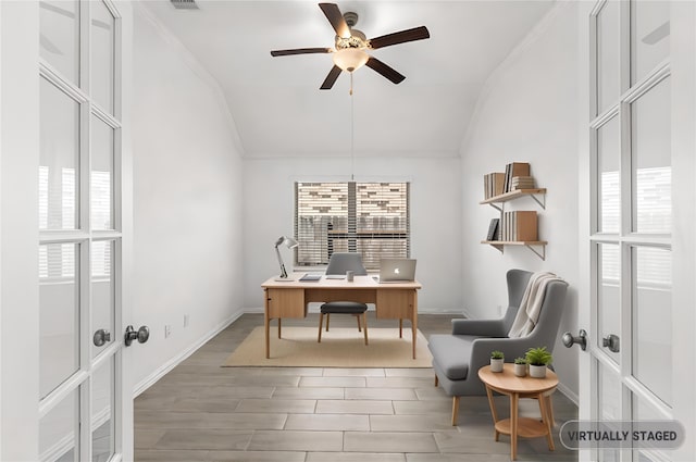 office with wood tiled floor, ornamental molding, and vaulted ceiling