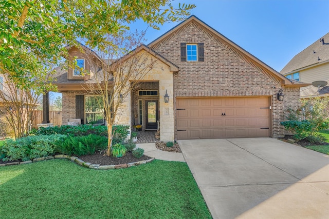 traditional home featuring a garage, brick siding, driveway, and a front lawn