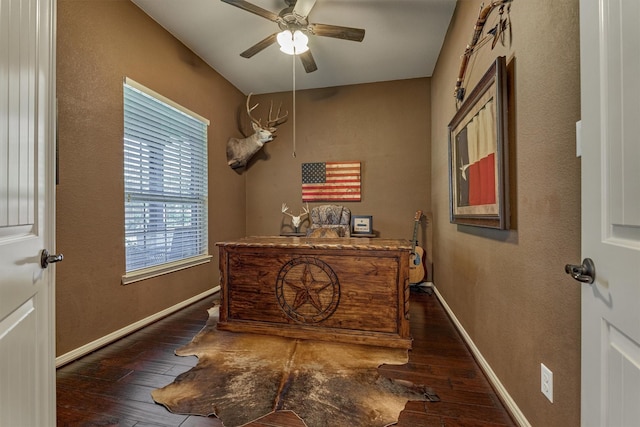 interior space with ceiling fan, baseboards, and dark wood-style flooring