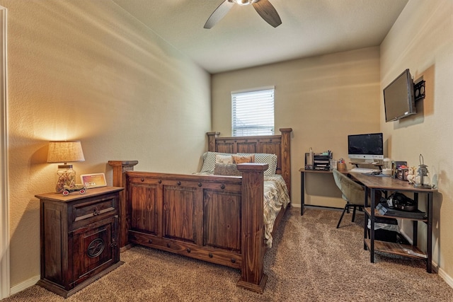 carpeted bedroom with a ceiling fan and baseboards