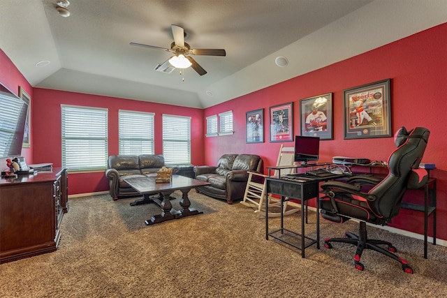 carpeted home office with visible vents, baseboards, vaulted ceiling, and a ceiling fan