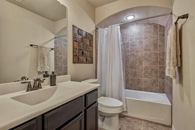 bathroom with toilet, tile patterned floors, shower / bath combination with curtain, and vanity