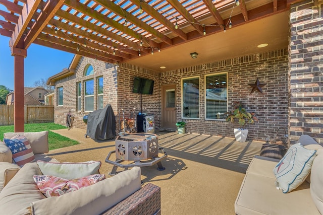 view of patio / terrace featuring area for grilling, fence, an outdoor living space with a fire pit, and a pergola