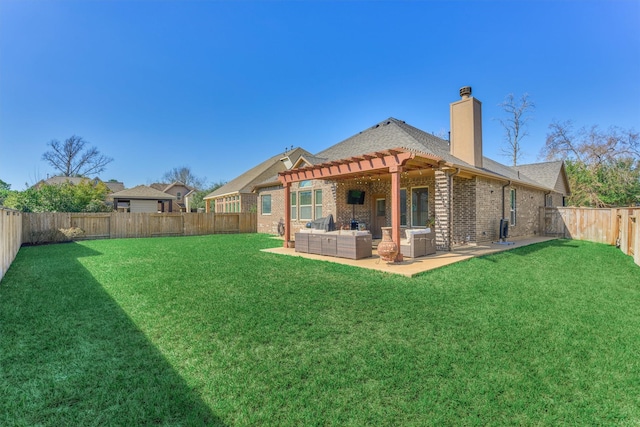 back of house featuring brick siding, a patio, a chimney, a lawn, and an outdoor living space