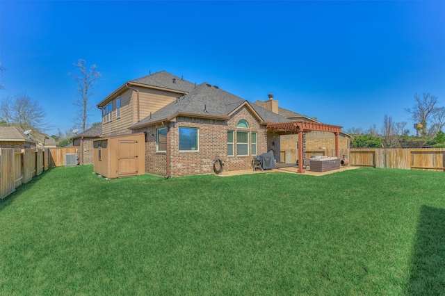 back of property with a patio area, a fenced backyard, a lawn, and brick siding