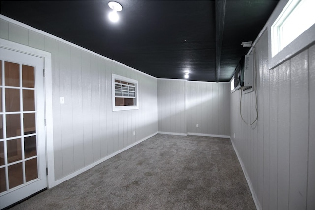 carpeted empty room with baseboards