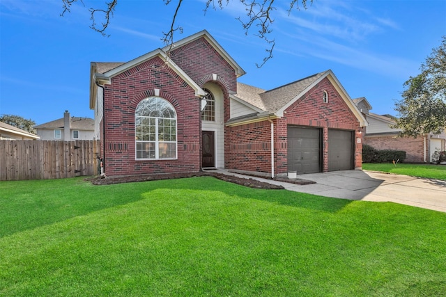 traditional-style house featuring fence, an attached garage, a front lawn, brick siding, and driveway