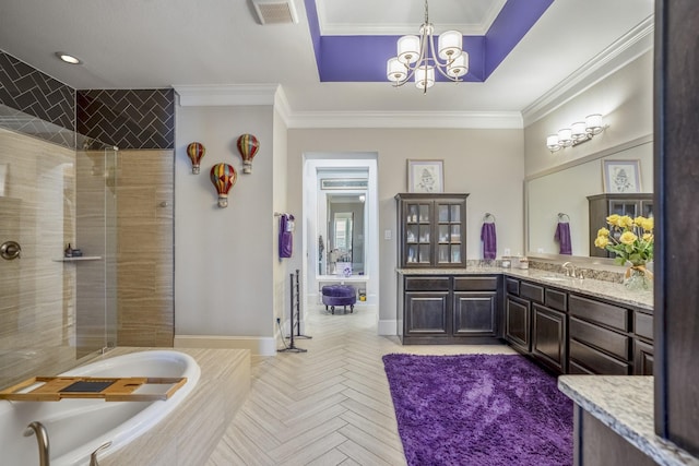 full bath with crown molding, a raised ceiling, visible vents, vanity, and a bath