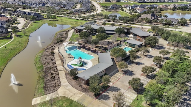 birds eye view of property featuring a residential view and a water view