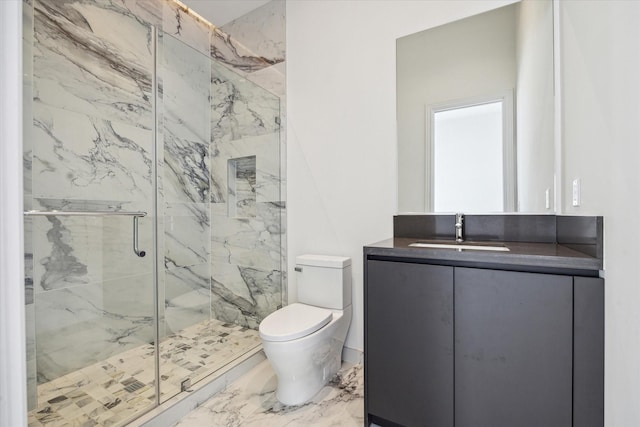 bathroom featuring marble finish floor, vanity, a marble finish shower, and toilet