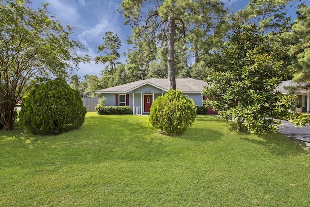 ranch-style home with a front lawn