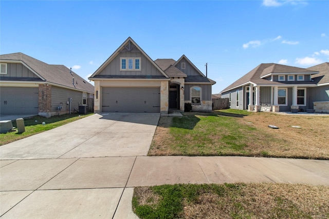 craftsman-style home featuring concrete driveway, board and batten siding, central AC, a garage, and a front lawn